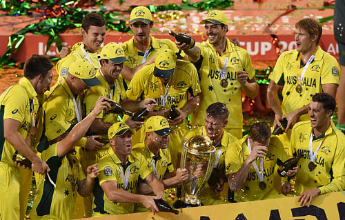 The Australian team spray champagne as they celebrate their seven wicket win over New Zealand in the ICC Cricket World Cup final in Melbourne, Australia. AP Photo