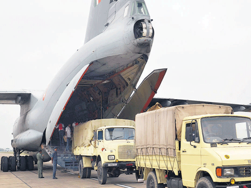 Relief material being loaded in an Indian Air Force cargo aircraft at Bathinda Air Base on Monday for relief works in Jammu and Kashmir. PTI Photo