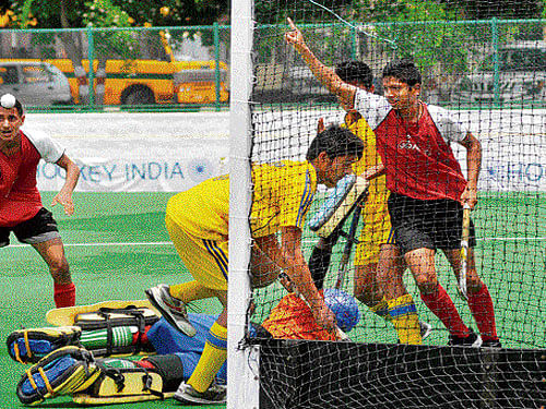 That's A Goal! Jammu & Kashmir's Harsh Vaid (right) celebrates after scoring a goal against Madhya Pradesh. DH PHOTO