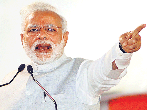 SILENCINGOPPOSITION: Prime Minister NarendraModi addresses a rally at theNational College Grounds in Bengaluru on Friday. DH PHOTO /SRIKANTA SHARMA R