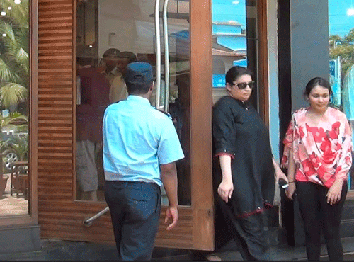 HRD Mnister Smriti Irani coming out of a showroom where she found a camera installed inside the changing room, at Candolim, Goa on Friday. PTI Photo