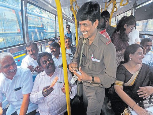 happy journey: MLA B N&#8200;Vijay Kumar, MLC T Sharavana, BMTC Managing Director Ekroop Caur travel by the bus to mark the 63rd Bus Day in the City on Saturday. dh Photo
