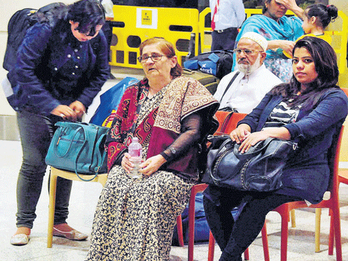 Indians who were stranded in Yemen after their arrival at the International Airport in Mumbai on Sunday. PTI