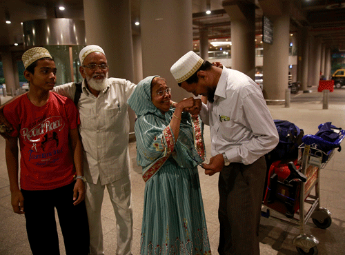 An Indian Muslim man greets his mother after she arrived at Chhatrapati Shivaji International Airport in Mumbai, India, Monday April 6, 2015 after being evacuated from Yemen. AP file photo