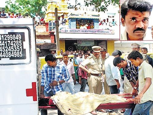murder in daylight: The body of Manju (inset), a real estate agent, is being taken to hospital for post-mortem after his younger brother, Madhu, killed him over a property dispute. dh Photo