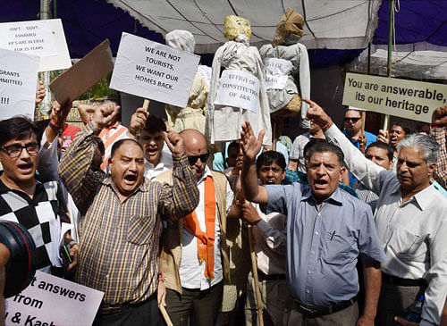 Members of All Parties Migrants Coordination Committee (APMCC) holding a protest against separatists call of thwarting the return of Kashmiri Pandit to the valley, in New Delhi on Saturday. PTI Photo