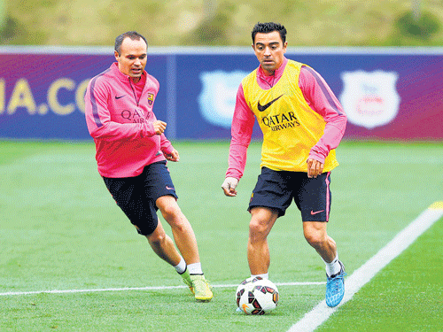 terrific duo: Andres Iniesta (left) and Xavi Hernandez laid emphasis on controlling and dominating the game rather than on the end result. ap