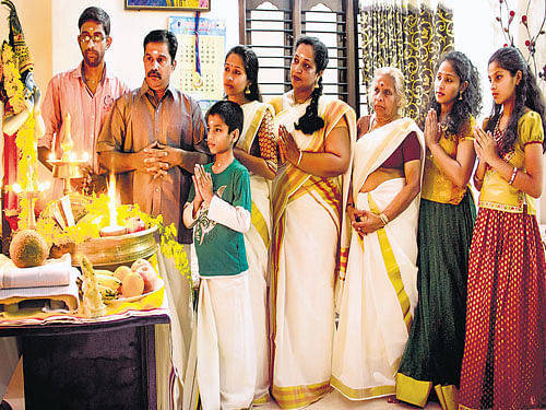 traditional Anjali (third from left) and Sindhu Padmakumar (fourth from left) with their family are looking forward  to the festivities.