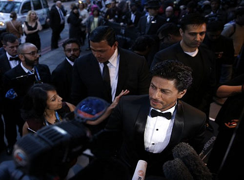 Indian Bollywood actor Shah Rukh Khan arrives for the Asian awards in central London. AFP photo