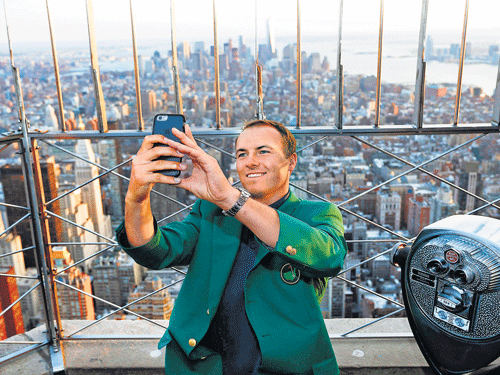 top of the world: Jordan Spieth, the new Augusta Masters champion, takes a selfie from the observation deck of the Empire State Building in New York. afp