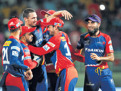 man of the moment: Paceman Nathan Coulter-Nile (centre) is mobbed by team-mates after Delhi Daredevils' win. Pti