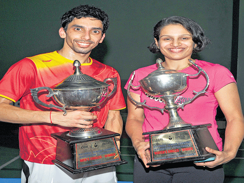 We're the champions: PSPB's RMV Gurusaidutt (left) and Maharashtra's Neha Pandit with their spoils at the Senior National Ranking Badminton Championships on Saturday. dh photo