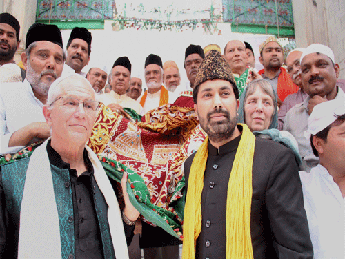 A 'chadar' (holy cloth), handed over by an official of the US Embassy on behalf of the US government, is carried before it was offered at the shrine of Khwaja Moinuddin Chishti during his Urs in Ajmer on Monday. PTI Photo