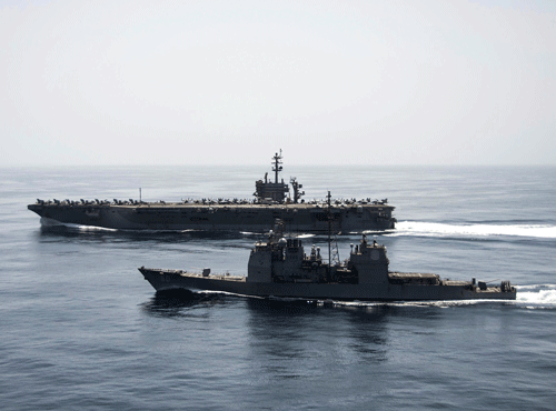 The aircraft carrier USS Theodore Roosevelt and guided missile cruiser Normandy operate in the Arabian Sea conducting maritime security operations. Reuters photo