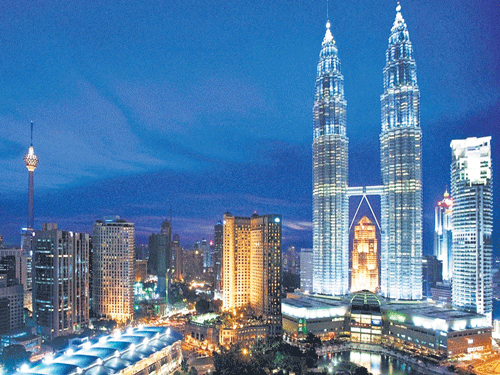 radiating The Petronas Towers at night;  (below) Lighting designer Martin Klaasen