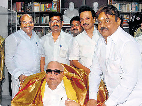 DMDK chief Vijayakanth meets DMK president M Karunanidhi on Sunday at his residence. DH photo