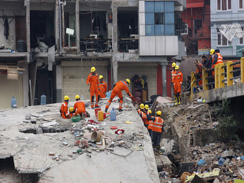 National Disaster Response Force personnel from India search for survivors in a building in Kathmandu on  Sunday. AP