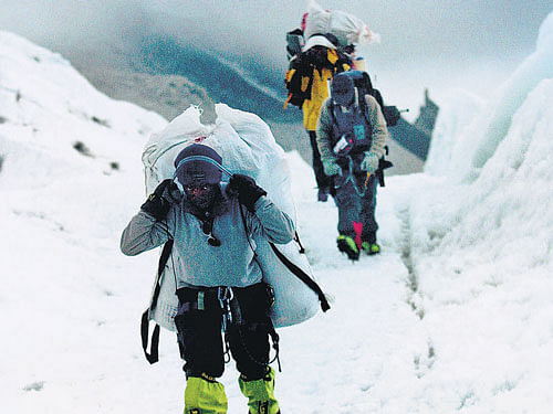 Sherpas with luggage make their way through Khumbu Icefall, near Everest Base Camp. AP file