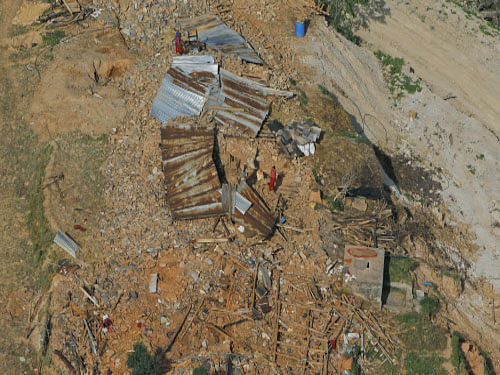 Houses flattened in an earthquake are seen from an Indian Air Force helicopter in Melamchi, Sindhupalchowk district, Nepal. AP