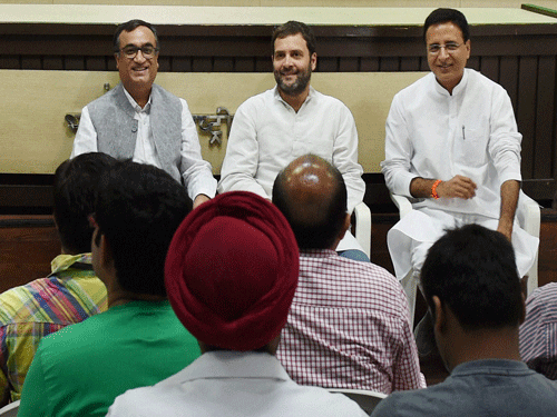 AICC Vice President Rahul Gandhi with Delhi Congress chief Ajay Maken and party leader Randeep Surjewala meeting with representatives of organizations of home/flat buyers in Delhi-NCR region, at AICC office in New Delhi on Saturday. PTI Photo.