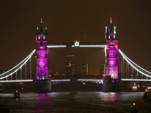Tower Bridge is lit up to celebrate the Duke and Duchess of Cambridge's newborn baby, in London. AP Photo
