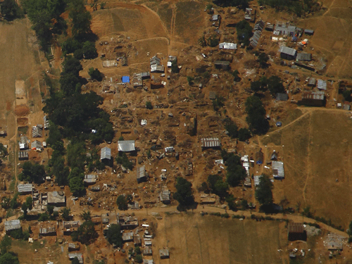 Collapsed and damaged houses are pictured from a helicopter after last week's earthquake at Sindhupalchok District, Nepal May 3, 2015. Reuters File Photo.