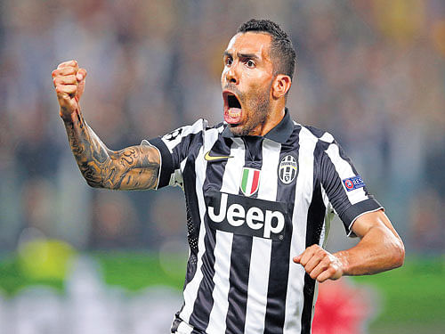 sensational: Juventus' Carlos Tevez celebrates after scoring against Real Madrid in their Champions League first leg tie on Tuesday. AP