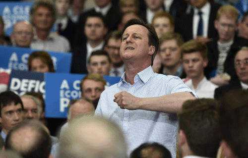 Conservative Party leader, Britain's Prime Minister David Cameron addresses party activists at an election campaign rally in Carlisle, England, Wednesday May 6, 2015. Britain's political candidates are campaigning all across Britain in search of votes ahead of the May 7 General Election. AP