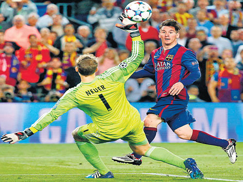masterly: Lionel Messi chips the ball over Bayern Munich goalkeeper Manuel Neuer for Barcelona's second goal on Wednesday. reuters