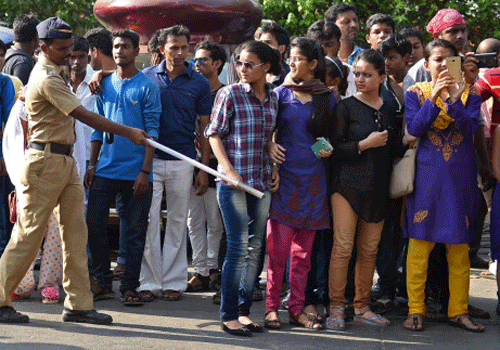 Police officials control the fans outside actor Salman Khans residence in Mumbai on Thursday. PTI