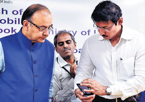 Arun Jaitley with Col Rajyavardhan Rathore, MoS for I & B ministry at the launch of a mobile application of DD News in New Delhi on Thursday. PTI