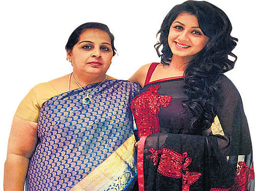 close ties Nikki with mother Anitha.