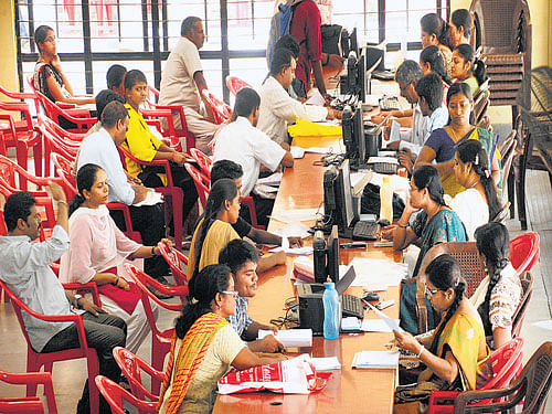 getting readY: Special category students get their documents checked at the CET cell in Bengaluru on Friday. DH&#8200;PHOTO