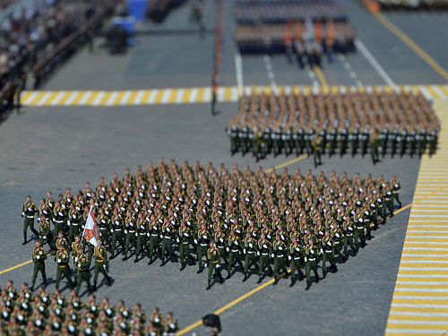 Russian servicemen march during the Victory Day parade at Red Square in Moscow, Russia, May 9, 2015. Russia marks the 70th anniversary of the end of World War Two in Europe on Saturday with a military parade, showcasing new military hardware at a time when relations with the West have hit lows not seen since the Cold War. Picture taken with a tilt and shift lens. Reuters Photo.