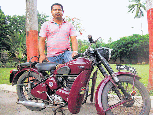 Two-wheeler collector Gahar Abedin with one of his motorbike in Bhubaneswar.
