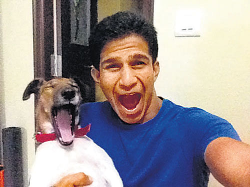 Cute Vignesh with his pet.