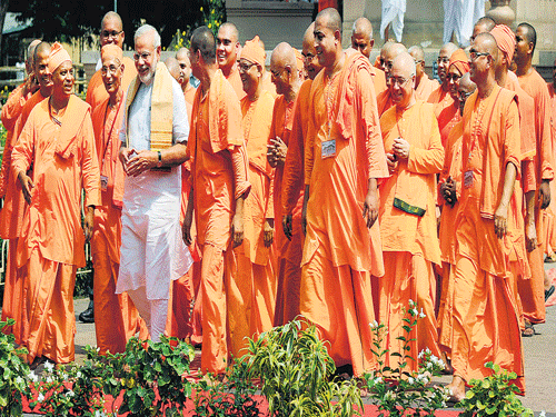tryst with monastic life: Prime Minister Narendra Modi walks with monks of Belur Math after visiting the temples in Belur, Kolkata, on Sunday. AFP