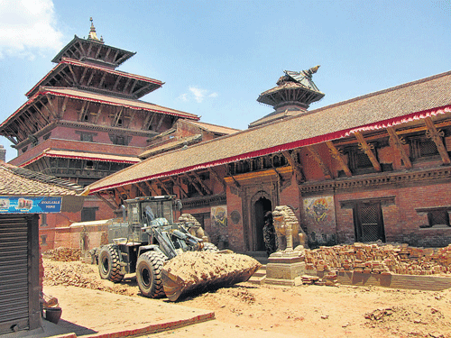 Earthmover used to clear the debris at the Patan Durbar Square near Kathmandu. dh photo/ Sagar Kulkarni