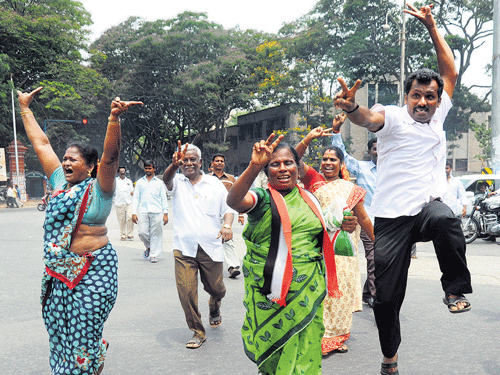 over the moon: AIADMK&#8200;leader J Jayalalitha's supporters jump in joy on hearing the news that the Karnataka High Court has acquitted their leader, in Bengaluru on Monday. Dh Photo