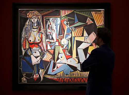 A man pauses to look at Pablo Picasso's "Les femmes d'Alger (Version 'O')" (Women of Algiers), estimated at $140 million, at a media preview for Christie's May 11 impressionist, modern and contemporary art sale in the Manhattan borough of New York. Reuters photo