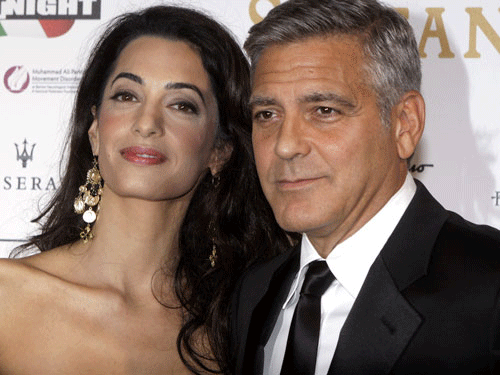Actor George Clooney with his wife Amal Alamuddin. AP photo