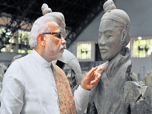 Prime Minister Narendra Modi at the Terracotta Warriors Museum in Xi'an, China, on Thursday. PTI
