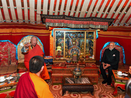 Prime Minster Narendra Modi with Hamba Lama (Chief Abbott) during a visit to the Gandan Monastery in Ulan Bator, Mongolia. PTI photo