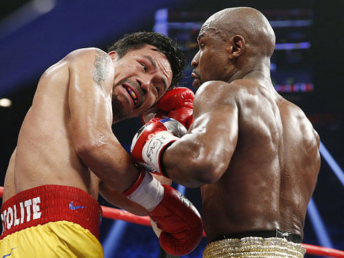 Manny Pacquiao and Floyd Mayweather Jr. AP File Photo.