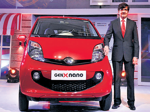 Tata Motors' Passenger Vehicle Unit President Mayank           Pareek unveils the 'GenX Nano' car  on Tuesday. Reuters