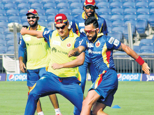 gearing up RCB&#8200;skipper Virat Kohli (right) and team-mates during a training session at Pune on Tuesday. pti  photo