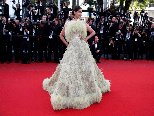 Indian actress Sonam Kapoor poses on the red carpet as she arrives for the screening of the animated film 'Inside Out' out of competition at the 68th Cannes Film Festival in Cannes. reuters photo