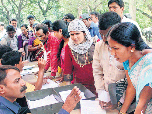 Students and parents enquire with the officials of the Department of Pre-University Education following glitches in the online display of results, at the PUC Board, at Malleswaram in Bengaluru on Wednesday. KPN