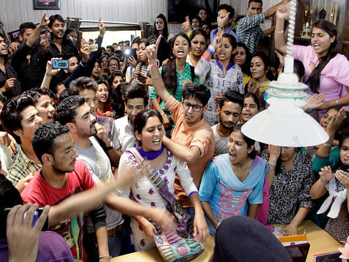 Students protest at Principal's office at a Government college in Dharamsala on Thursday. PTI Photo