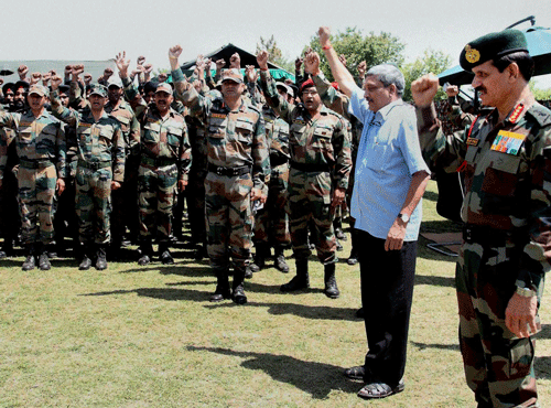 Defence Minister Manohar Parrikar with Army Chief General Dalbir Singh Suhag interacts with soldiers during a visit to the forward areas in the Rajouri Sector on Saturday. PTI Photo